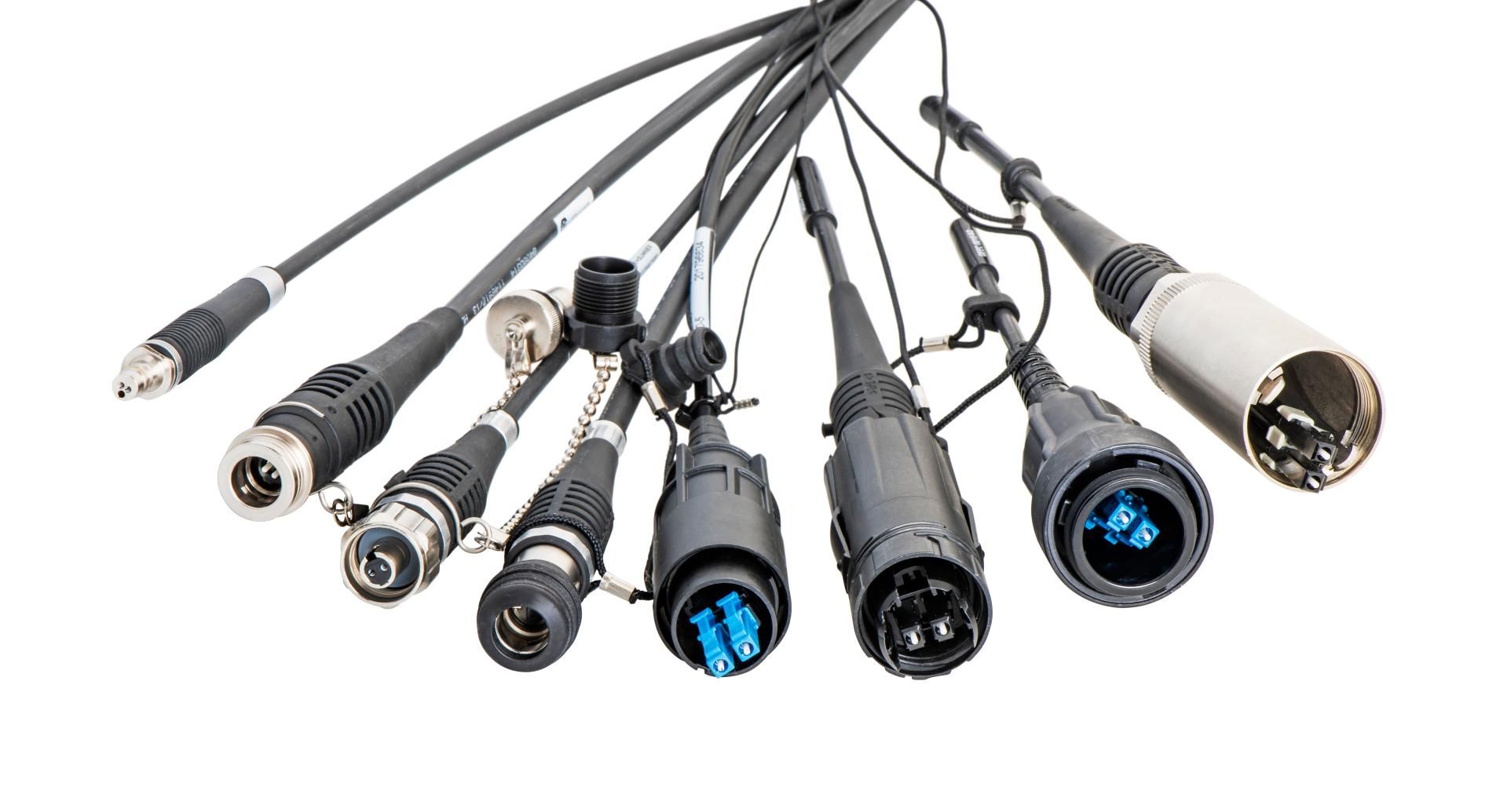 Diverse fiber optic outdoor connectors in a row