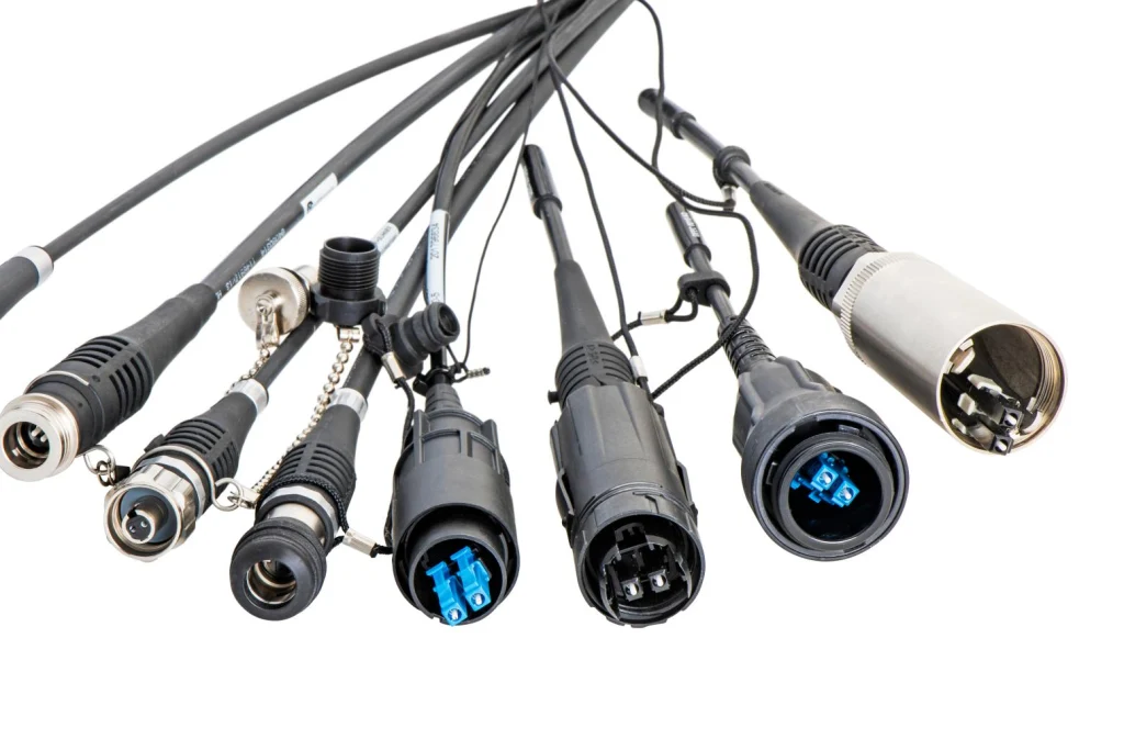 Diverse fiber optic outdoor connectors in a row