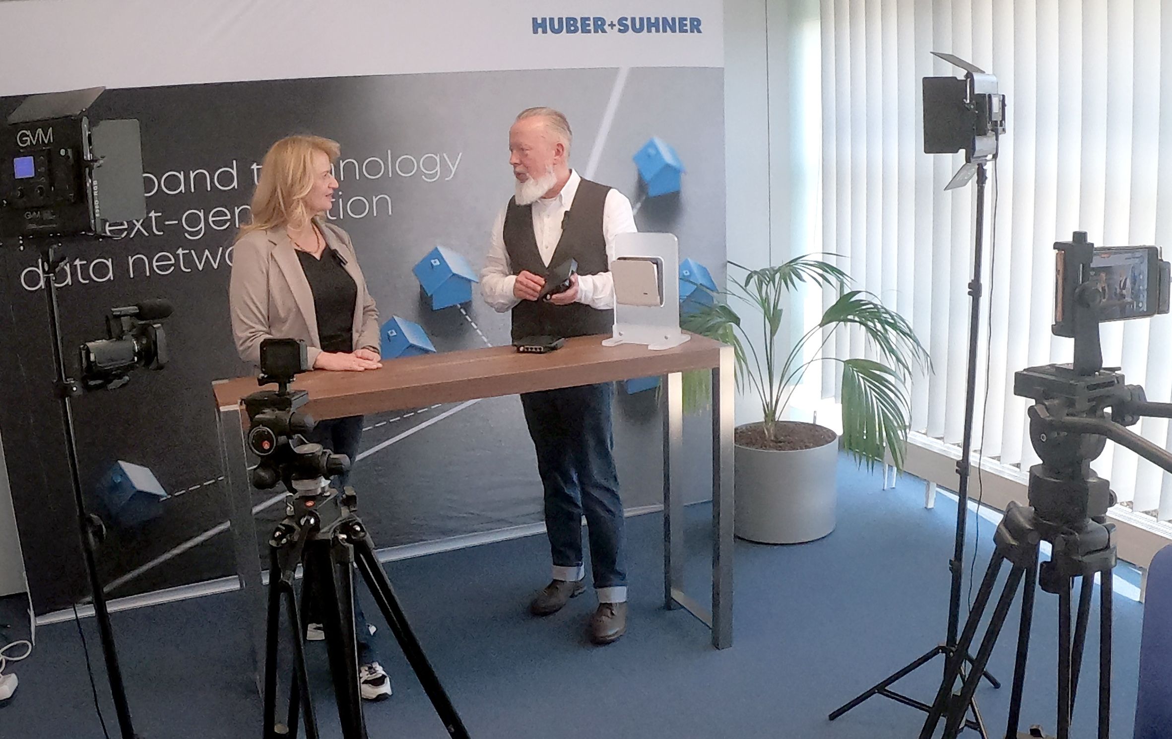 HUBER+SUHNER studio setup with product presentation and video recording equipment