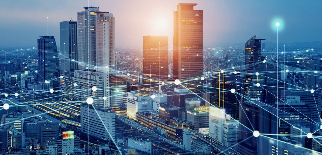 Smart city skyline with connected network technology illustrating optical circuit switching in telecom, AI, and data infrastructure