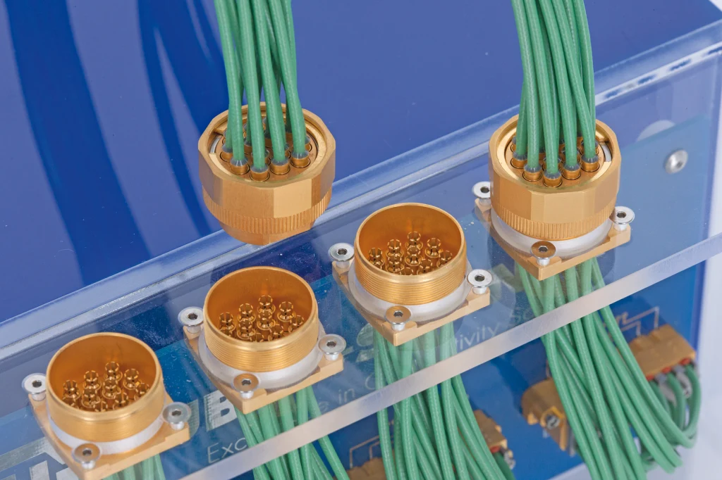 Multi-channel cable assembly with multiple green cables connected to a rectangular connector module. Multi-channel cable assembly with multiple green cables connected to a rectangular connector module.
