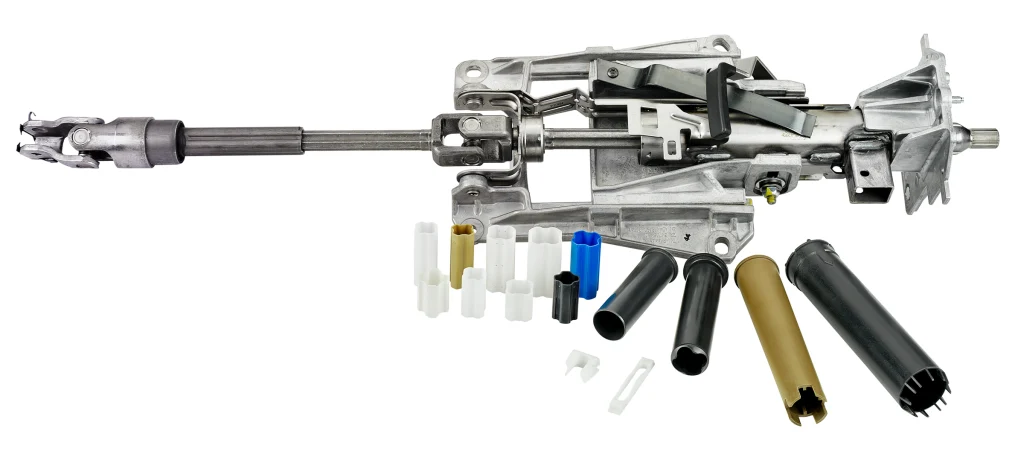 Automotive steering column assembly featuring precision injection-moulded plastic components for vehicle applications.