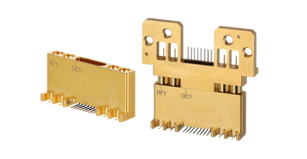 Pair of miniaturised RF/DC hybrid connectors displayed side by side. Pair of miniaturised RF/DC hybrid connectors displayed side by side.