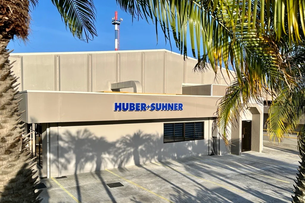 Factory site in Heredia Office building from outside - with HUBER+SUHNER signage