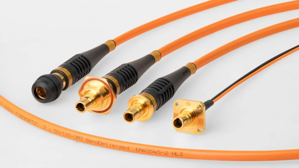 Q-ODC fibre optic connectors with attached orange fibre cables, shown in different termination variants.