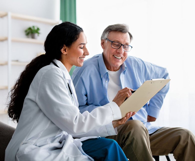 Doctor discussing proton therapy treatment plan with patient