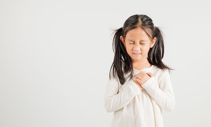Girl with Pain Clasping Hands on Chest