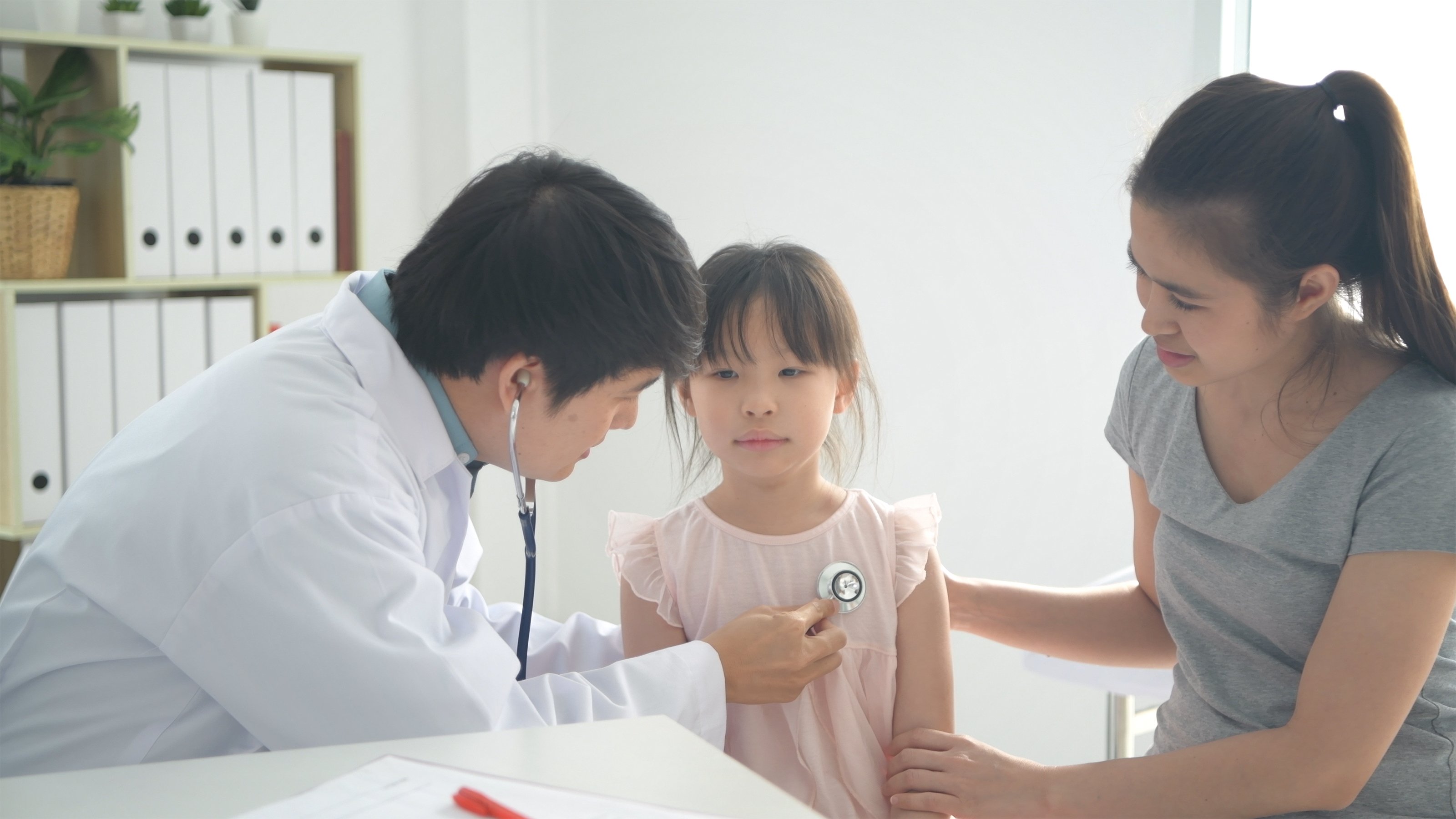 doctor-checking-child-after-seizure