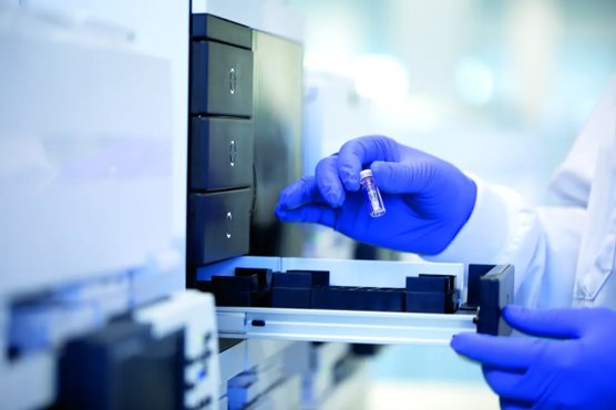 lab worker with vials