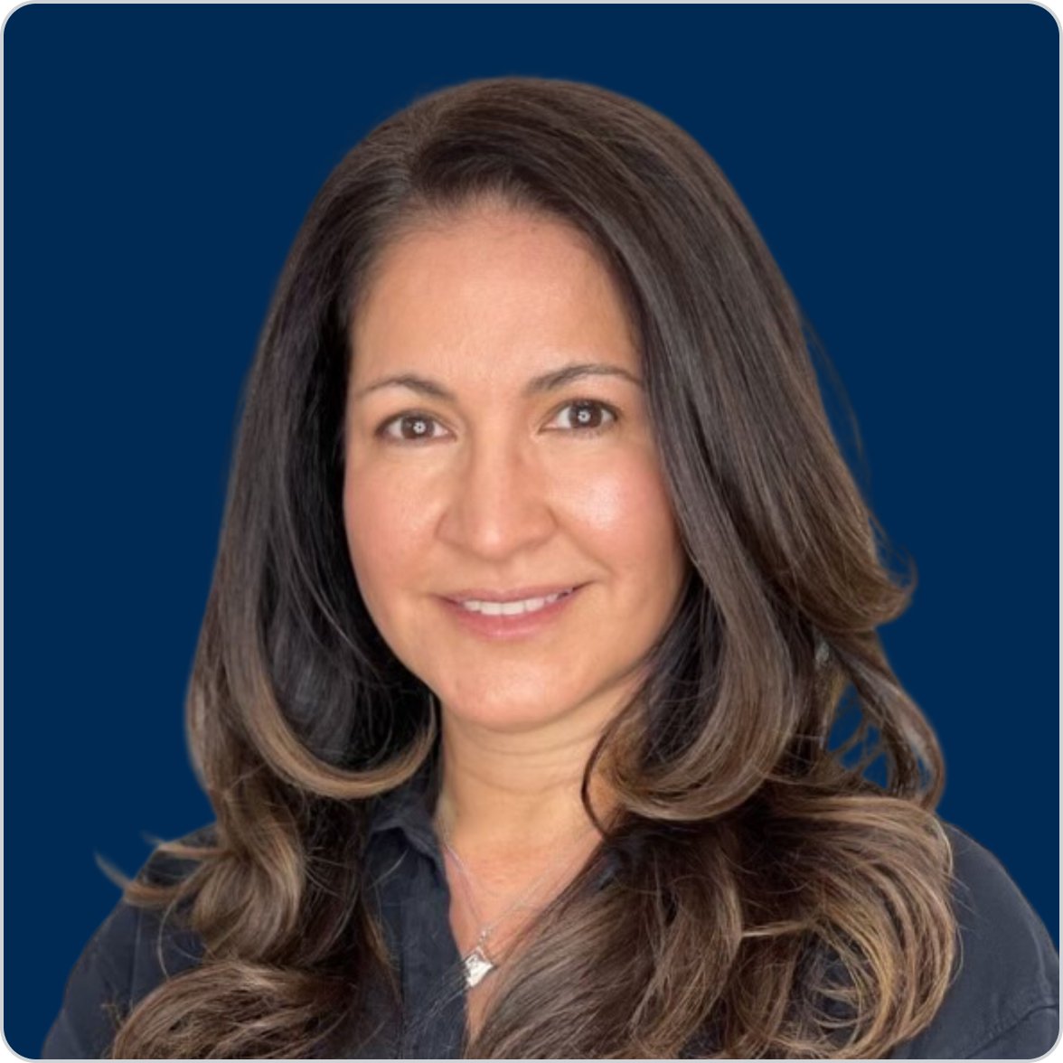 Portrait of Dr. Patricia Guevara, MD, Metagenics medical doctor and detoxification and reset expert, smiling against a dark blue background.