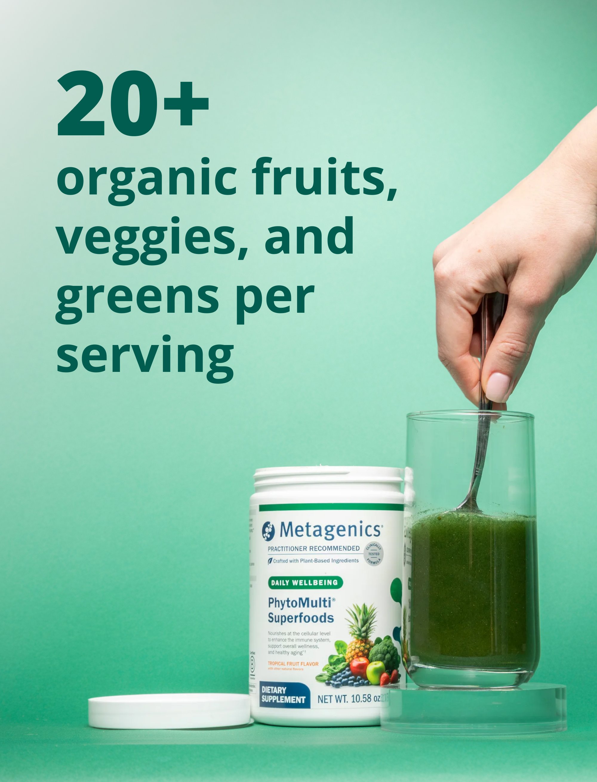 Container of Metagenics PhytoMulti Greens beside a glass of green drink with text stating that each serving includes more than twenty organic fruits, vegetables, and greens.