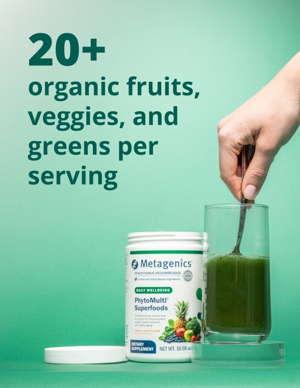 Container of Metagenics PhytoMulti Greens beside a glass of green drink with text stating that each serving includes more than twenty organic fruits, vegetables, and greens.