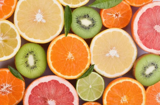 Sliced oranges, grapefruit, lemon, lime, tangerines, and kiwi rich in vitamin C