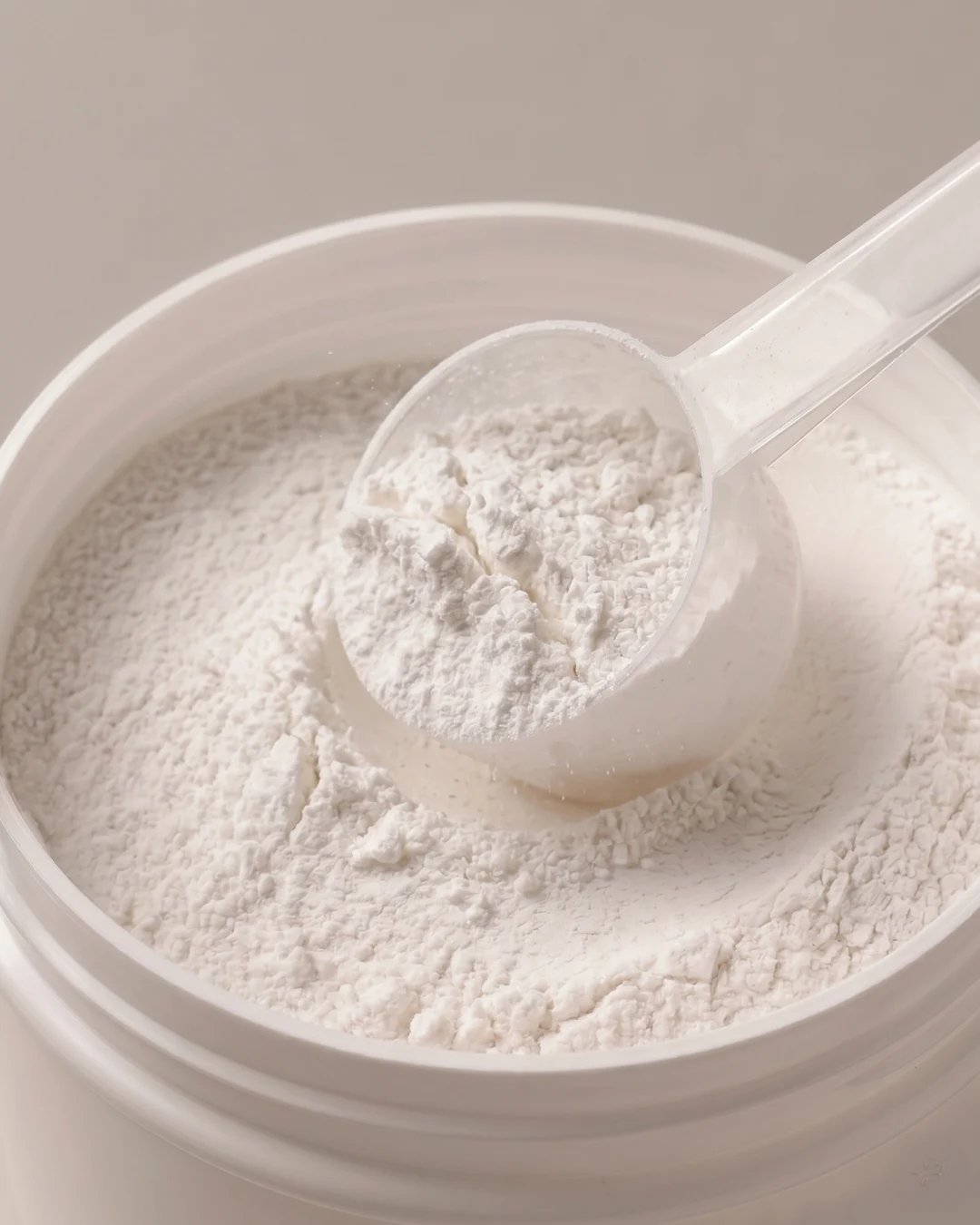 metagenics staystrong joint & muscle powder being scooped