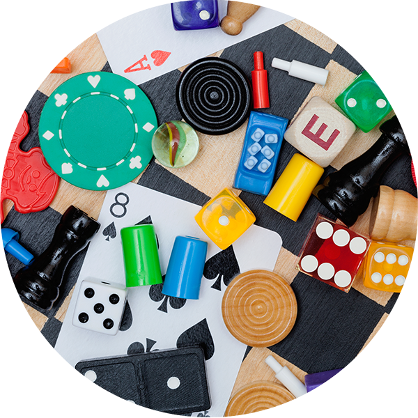 A close up of a selection of tabletop gaming pieces and cards