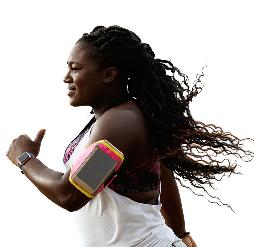 A person running outdoors with long hair flowing back, wearing a white tank top and a pink-and-yellow armband holding a smartphone against a bright, isolated background.