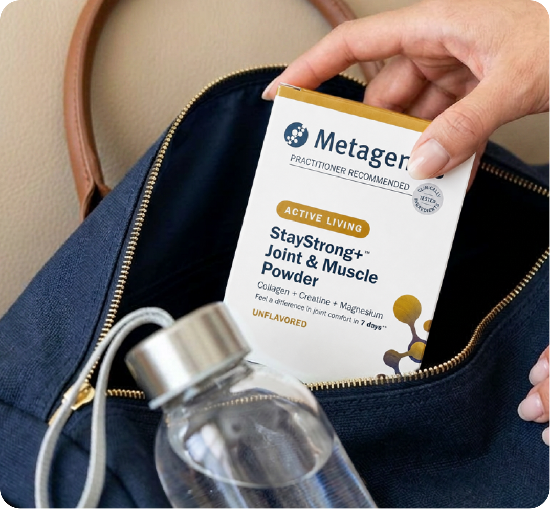 Hand pulling a box of Metagenics StayStrong+ Joint & Muscle powder supplement out of a gym bag as part of a daily wellness routine for self-care.