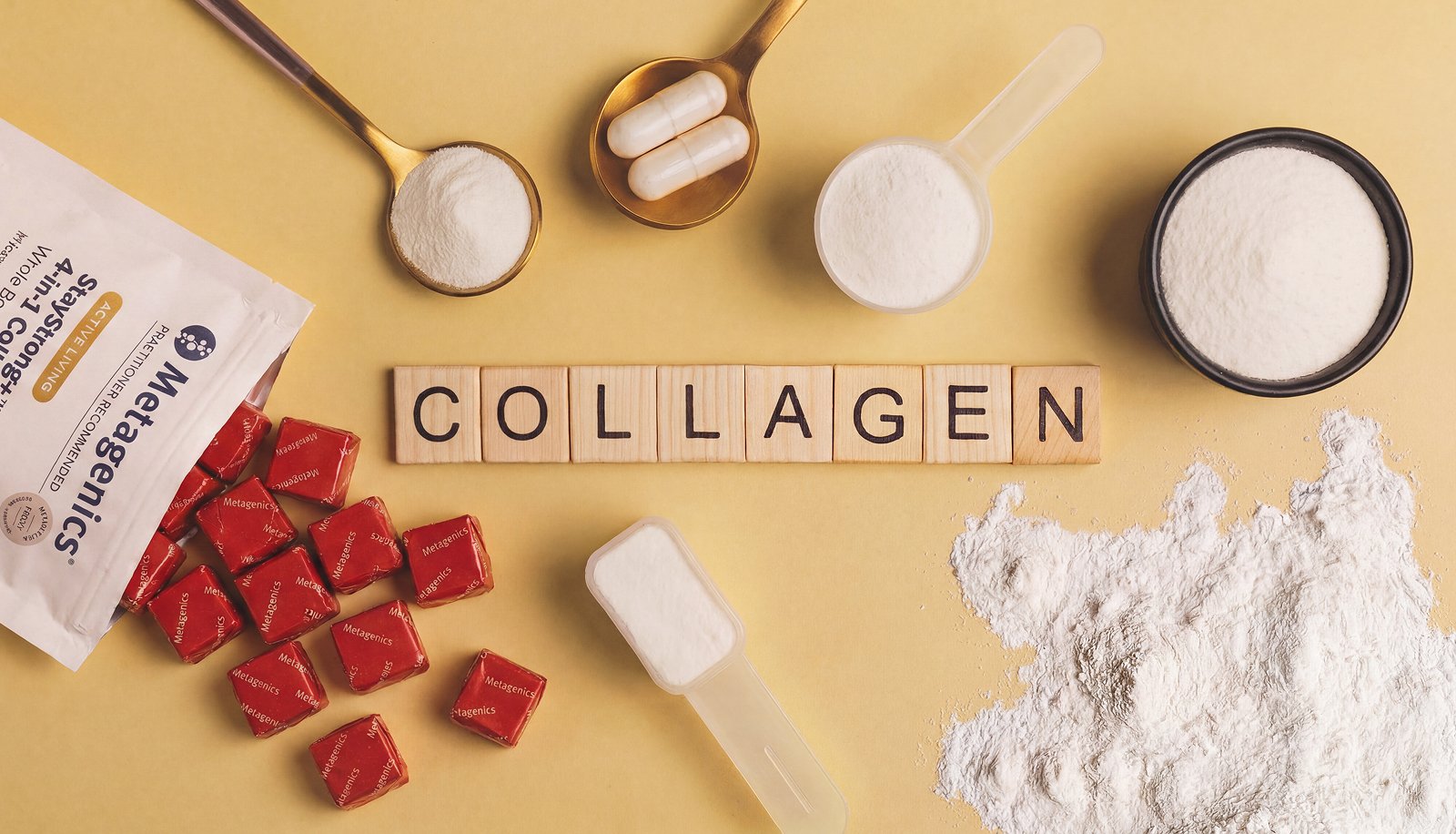 Flat lay showing different types of collagen supplements, including powder, capsules, soft chews, and collagen peptides, with the word "COLLAGEN" spelled out on wooden letter tiles.