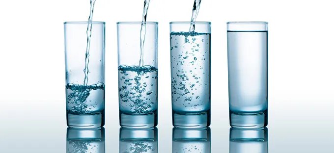 Four glasses of water to support hydration and digestive health
