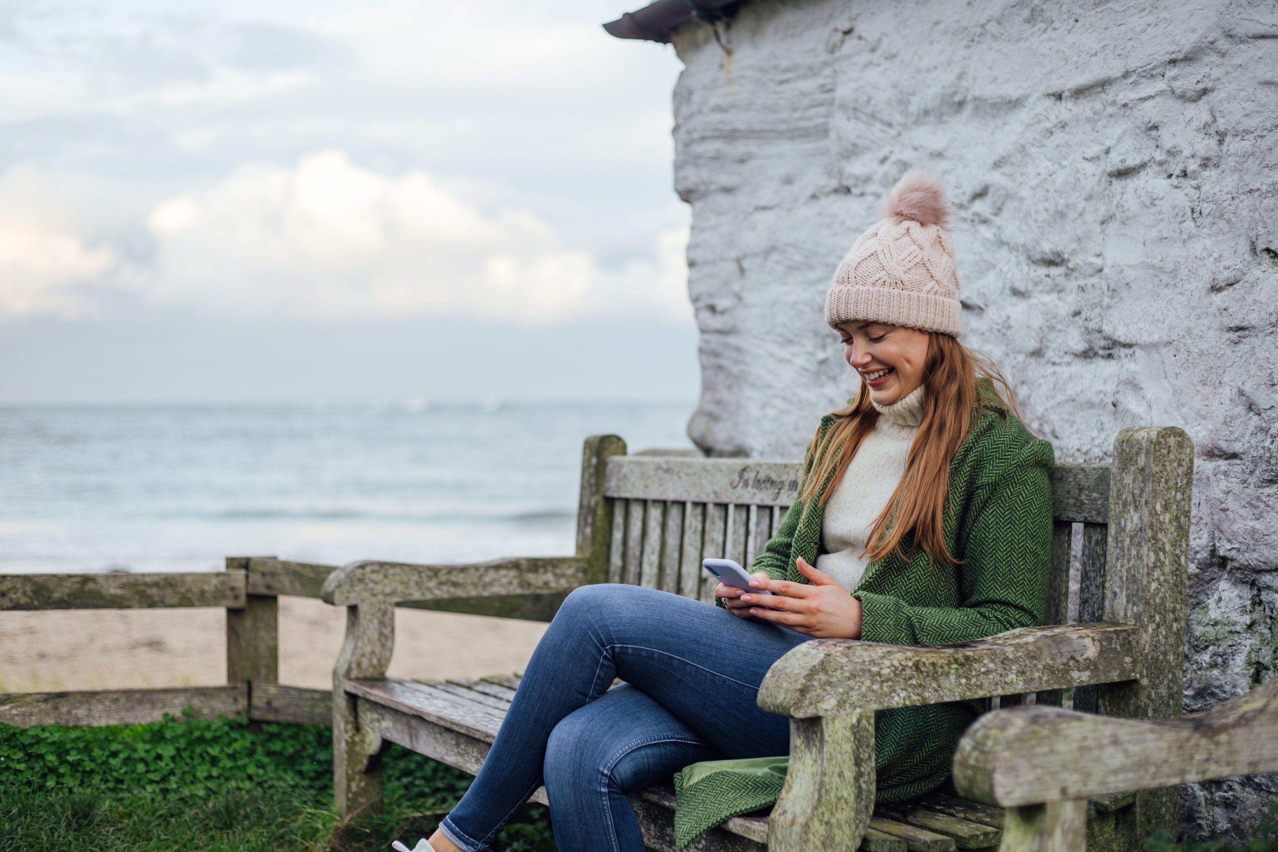A young woman resting and messaging friends