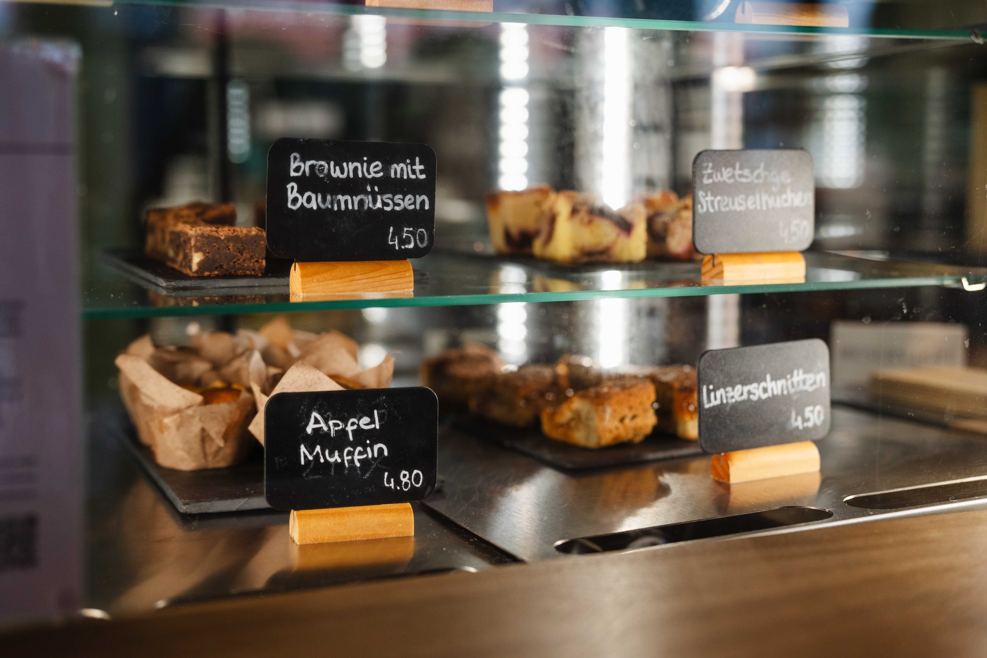 Various pastries on display, e.g. brownies or muffins.