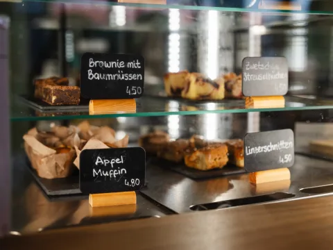 Various pastries on display, e.g. brownies or muffins.