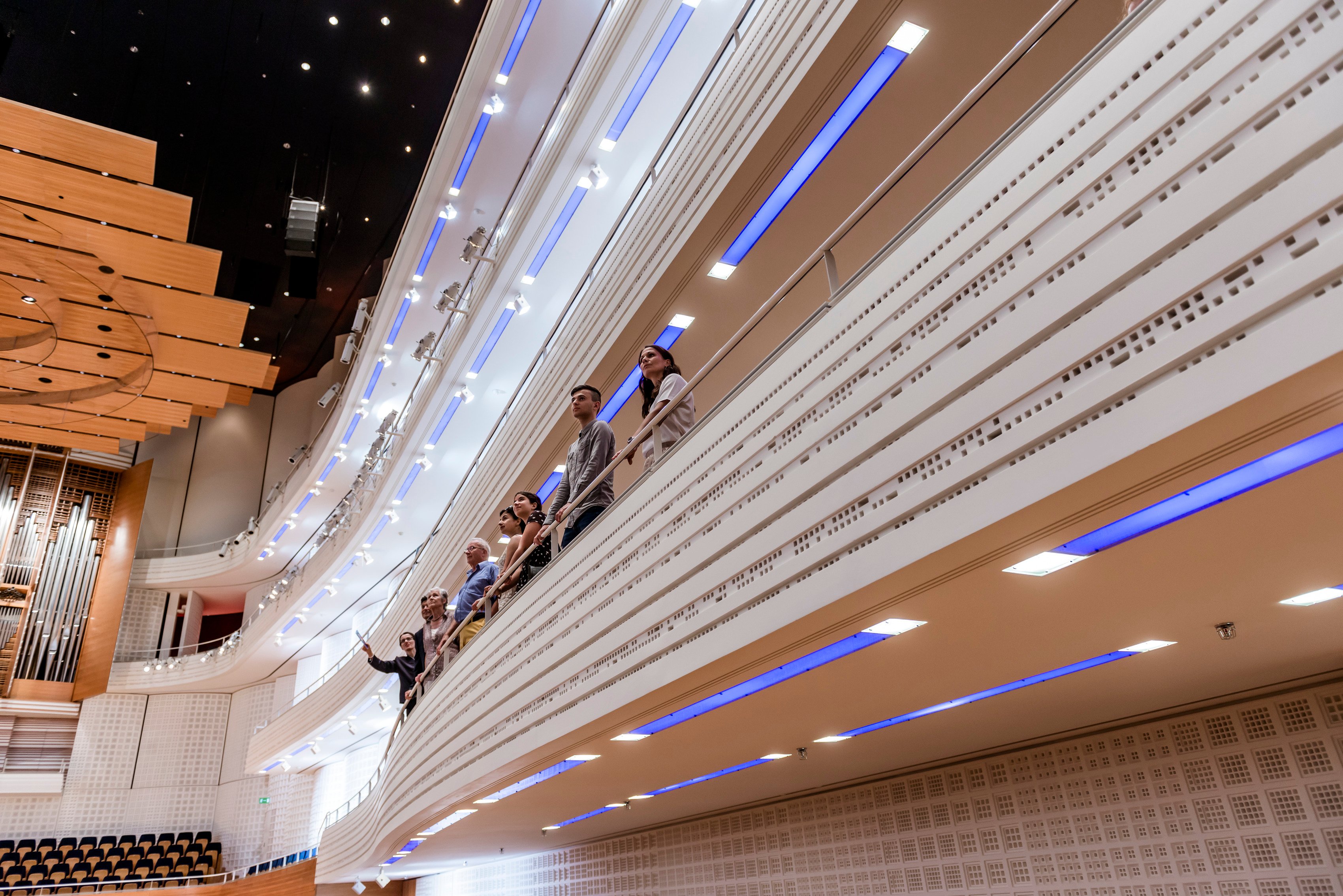 View of the concert hall KKL Luzern. People standing on a balcony in the concert hall.