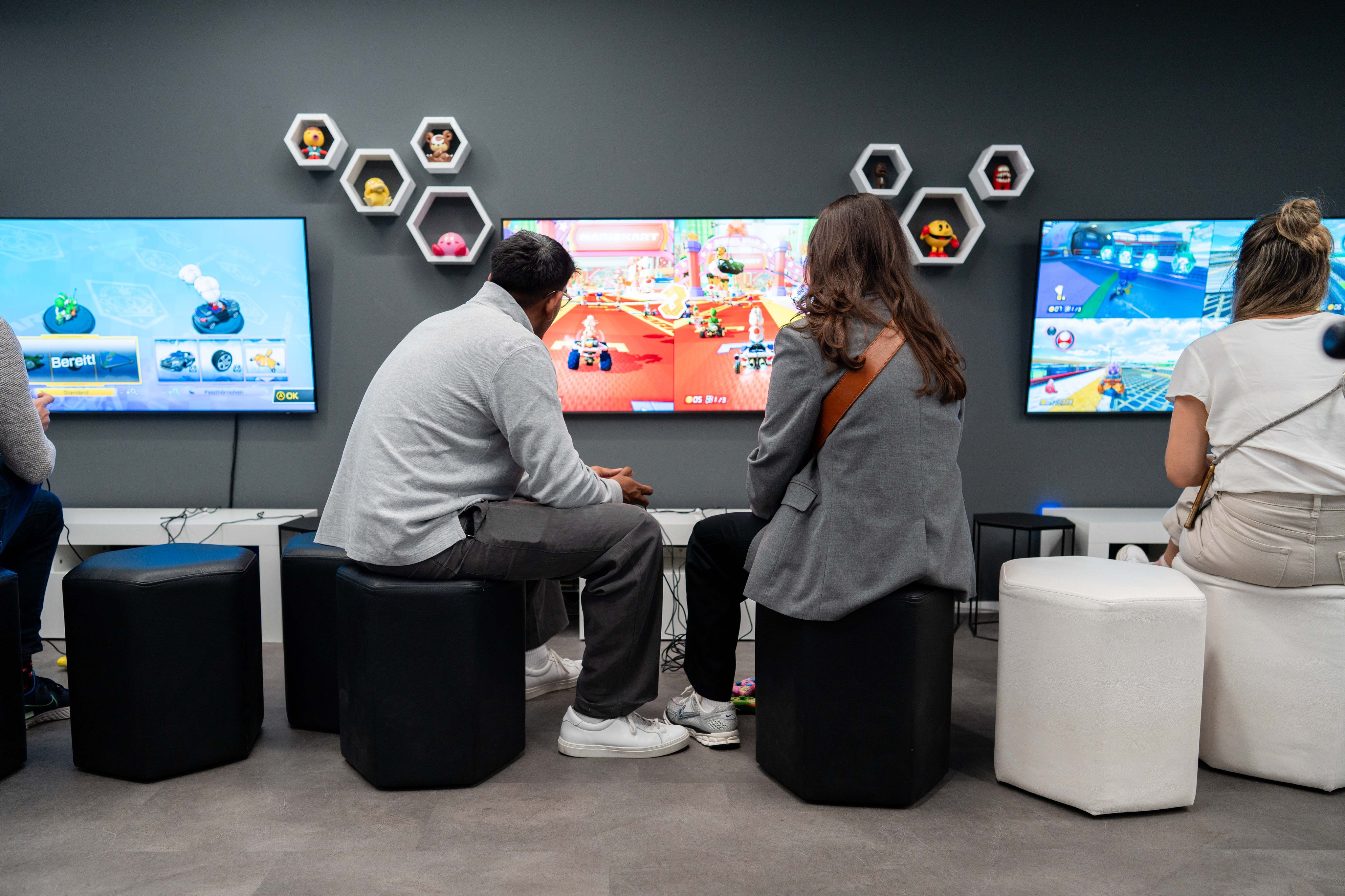 Man and woman playing Mario Kart.