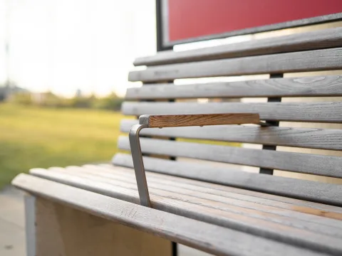 The redesigned wooden bench, taken in a small park.