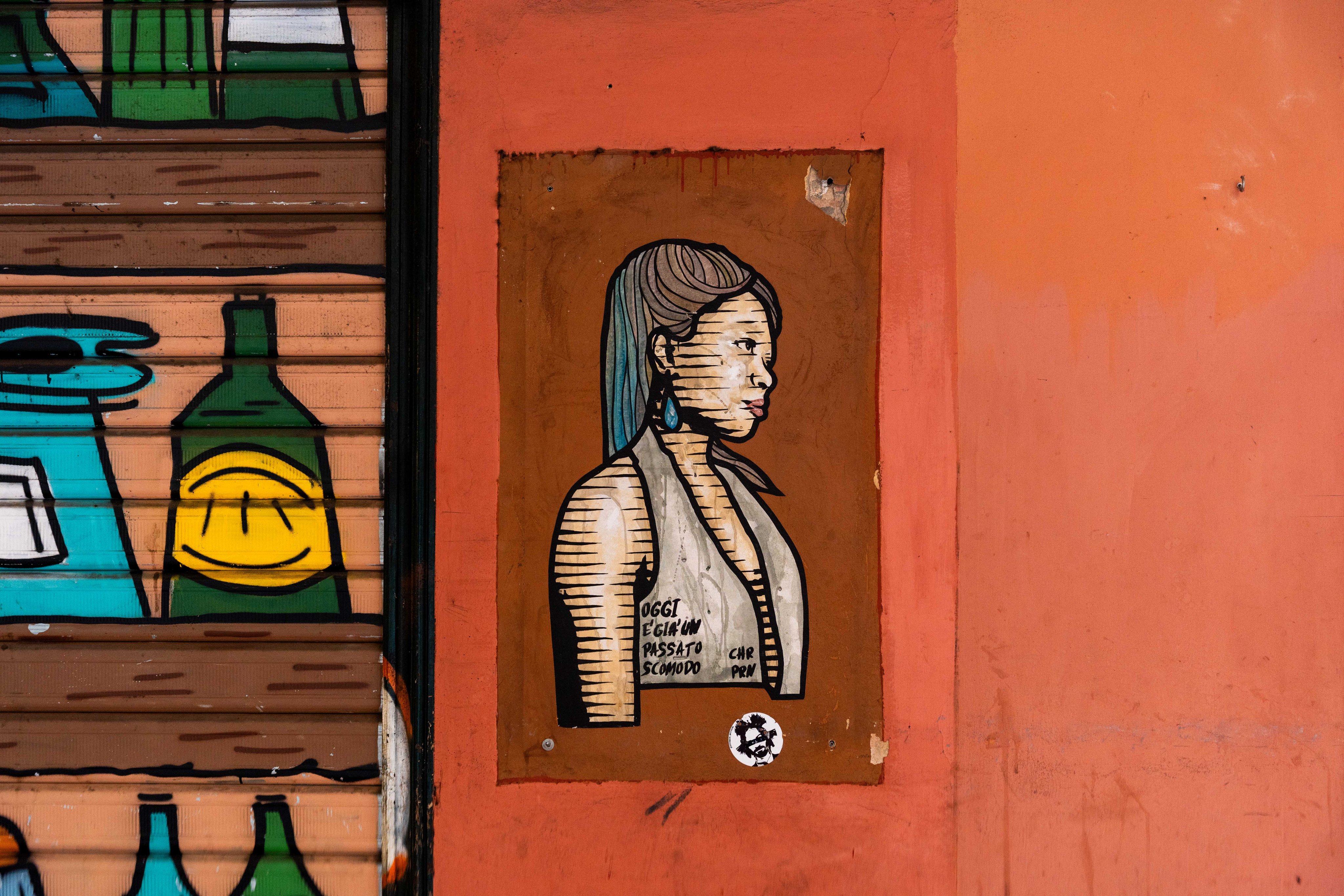 Graffiti on a house wall with a woman
