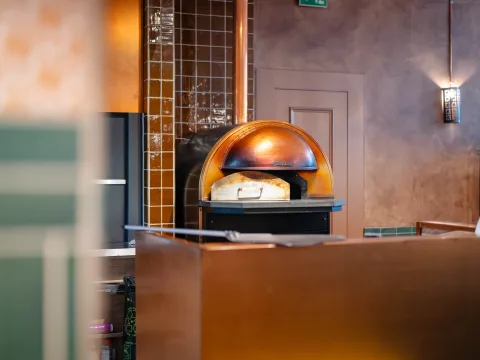 Stove behind the bar.