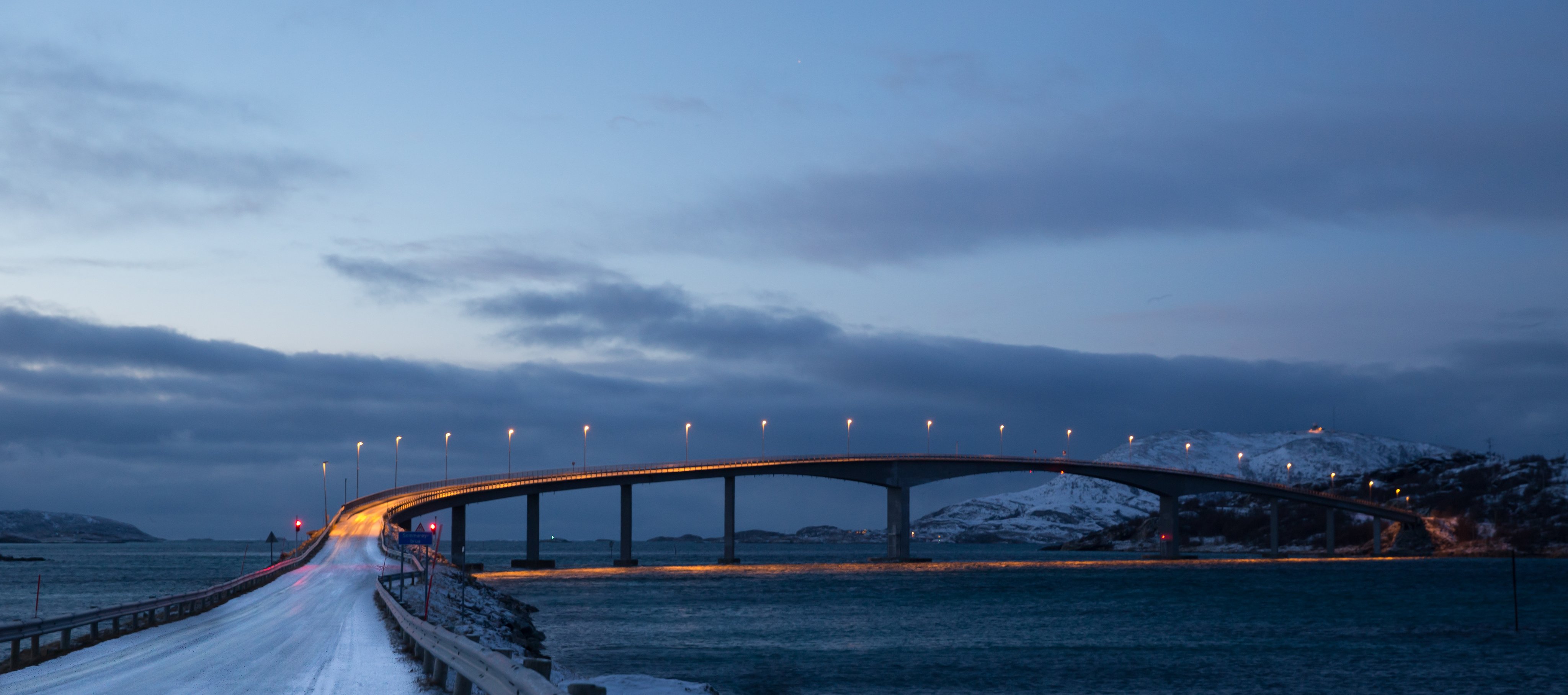 Bridge over water with a cloudy sky