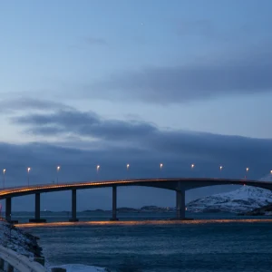 Bridge over water with a cloudy sky