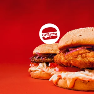 Kaksi hampurilaista punaista liukuväritaustaa vasten