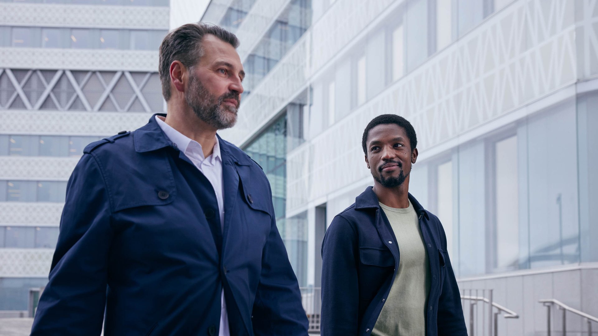 Two business men walking and talking