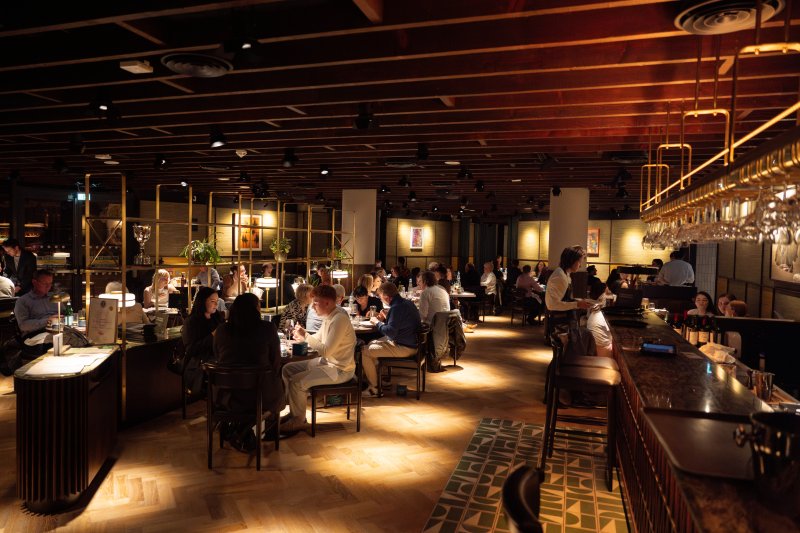 Guests dining in the contemporary restaurant setting at Academy Restaurant Belfast.