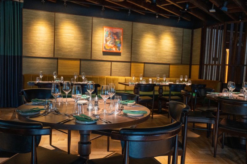 Contemporary dining room at Academy Restaurant Belfast with elegantly set tables.