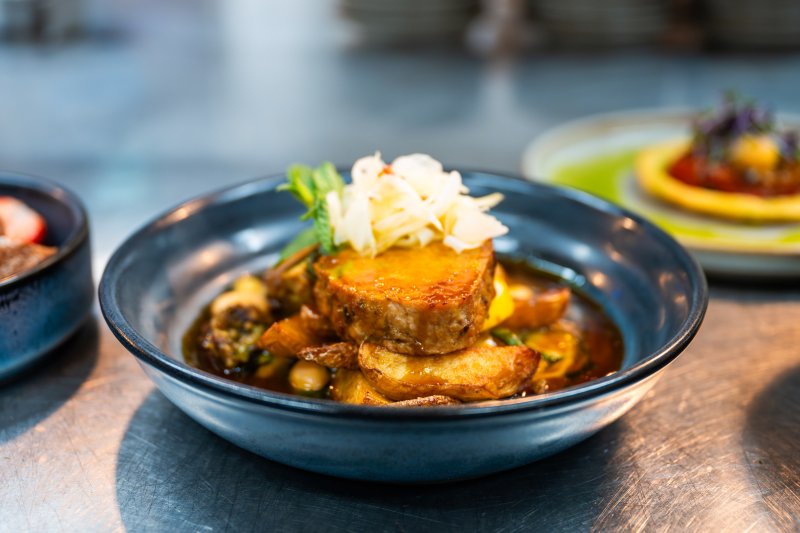 Pork medallion with roasted potatoes, seasonal vegetables and rich sauce at Academy Restaurant.