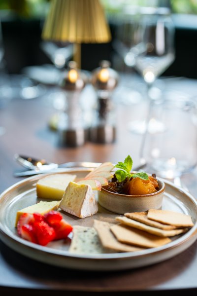 Artisan cheese board with crackers, chutney and locally sourced cheeses at Academy Restaurant.