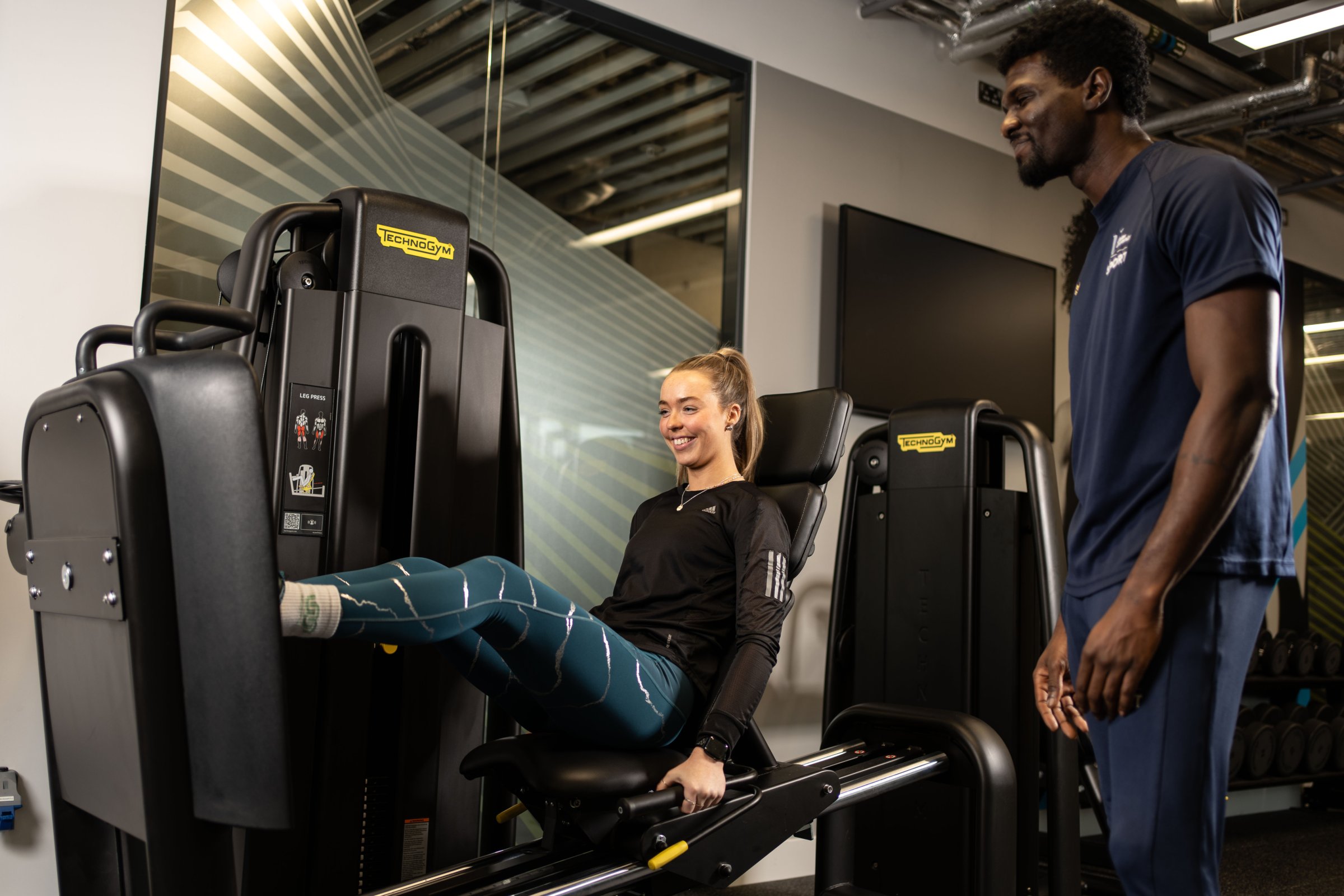 A student having a PT session in the gym