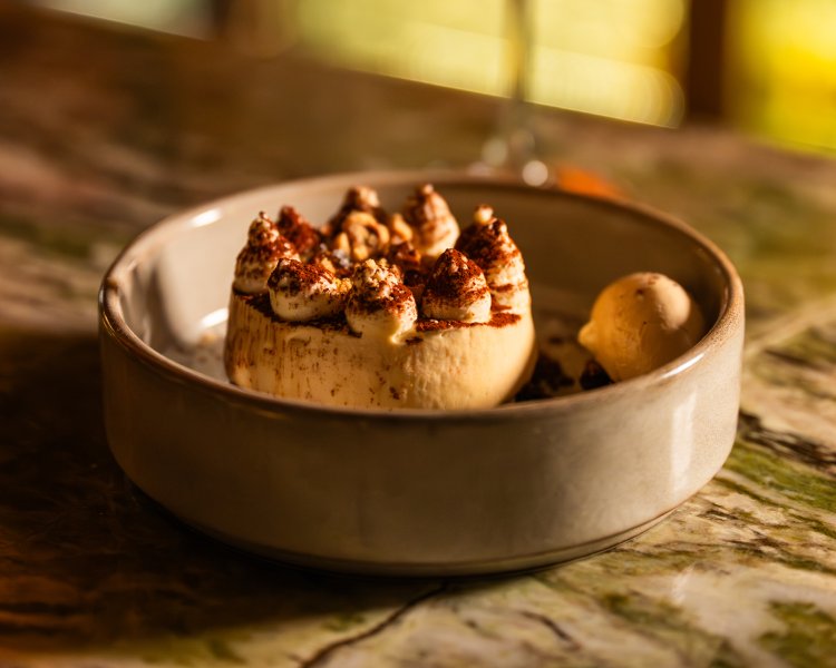 Elegant restaurant dessert with artisan presentation and ice cream at Academy Restaurant.