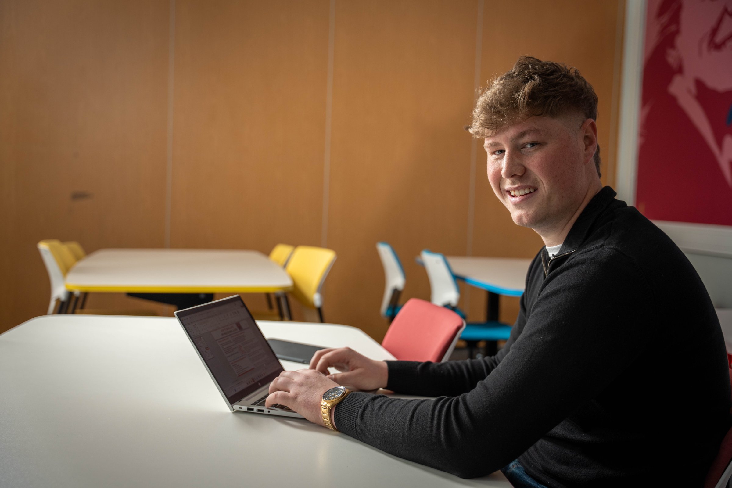 A young student looking at his laptop exploring Clearing options
