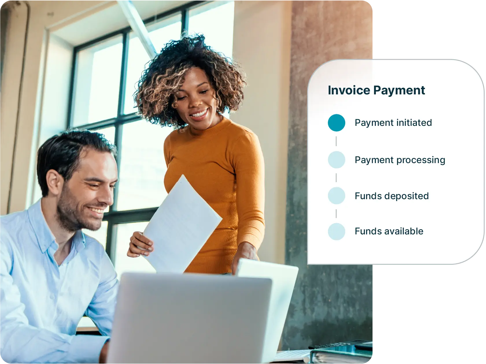 Coworkers check the progress of an invoice payment