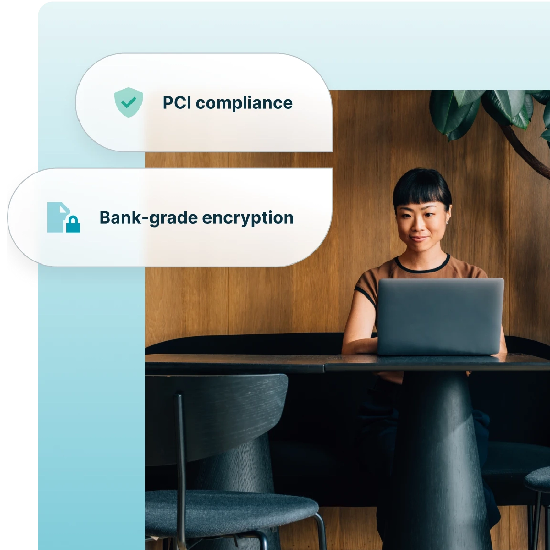 A business professional sits at a table using a laptop. Overlaid text reads PCI compliance with a checkmark icon and Bank-grade encryption with a lock icon. The setting is modern with wooden walls and a plant.