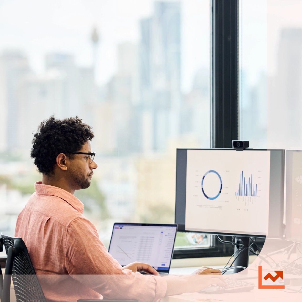 Law firm partner reviewing KPI dashboard and performance metrics on computer in modern office