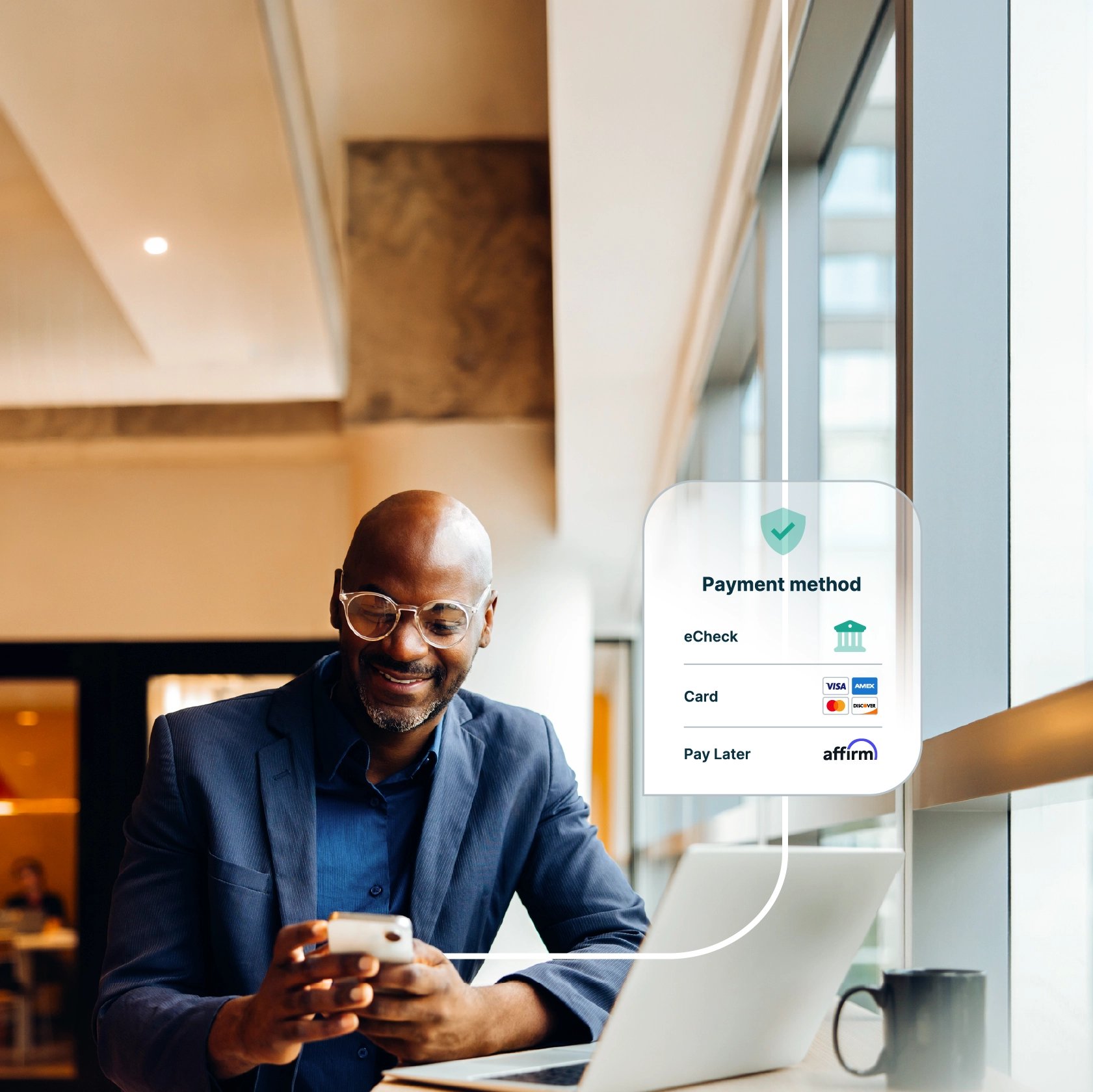 Business professional seated at a table using a smartphone beside a laptop. A payment options overlay displays eCheck, credit card, and Affirm Pay Later, illustrating digital invoice payment choices.