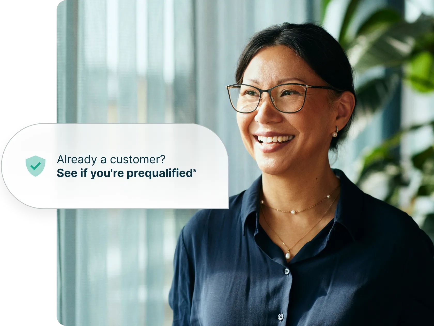 Woman smiling next to a pop up text bubble saying 'Already a customer? See if you're prequalified*'