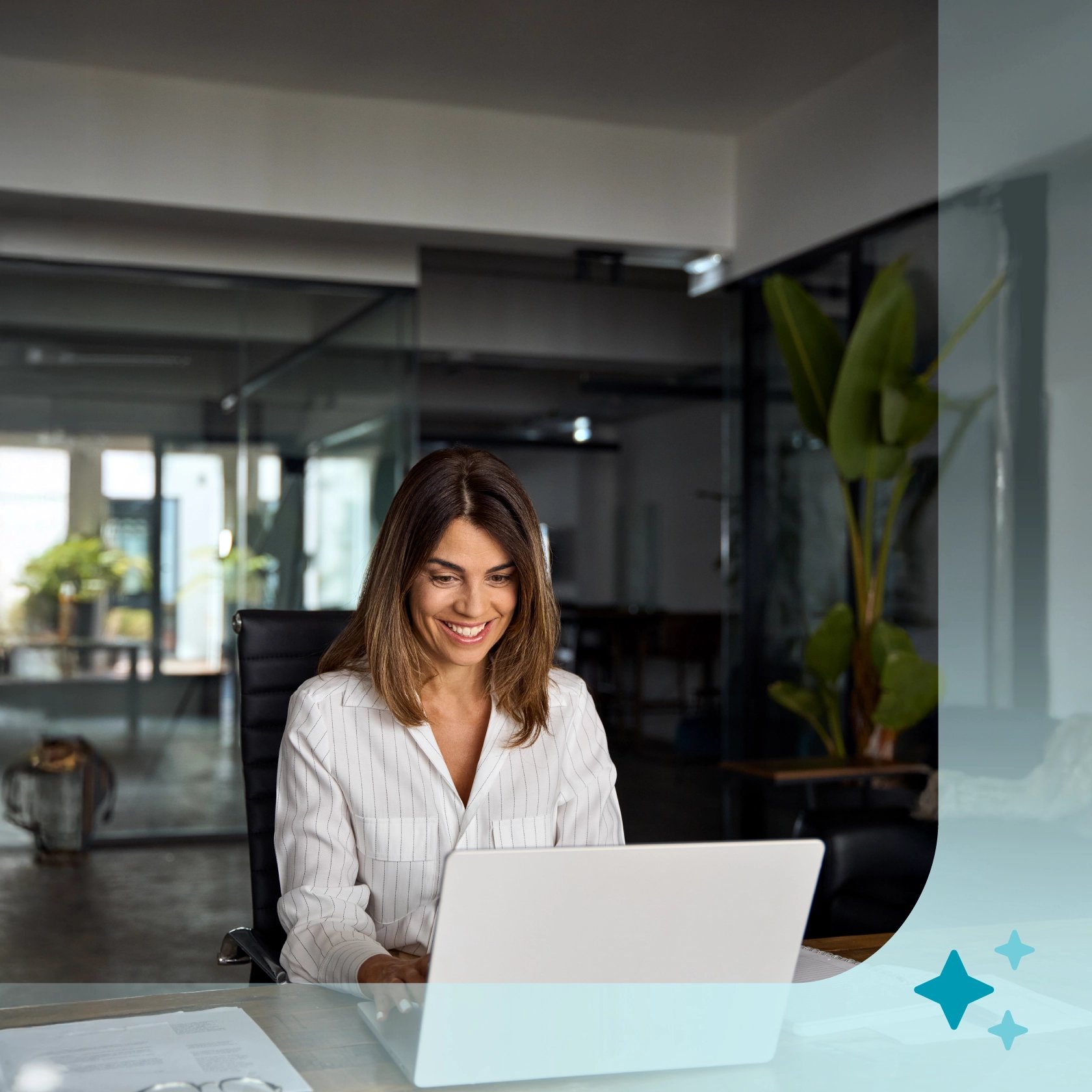 A woman works on her laptop