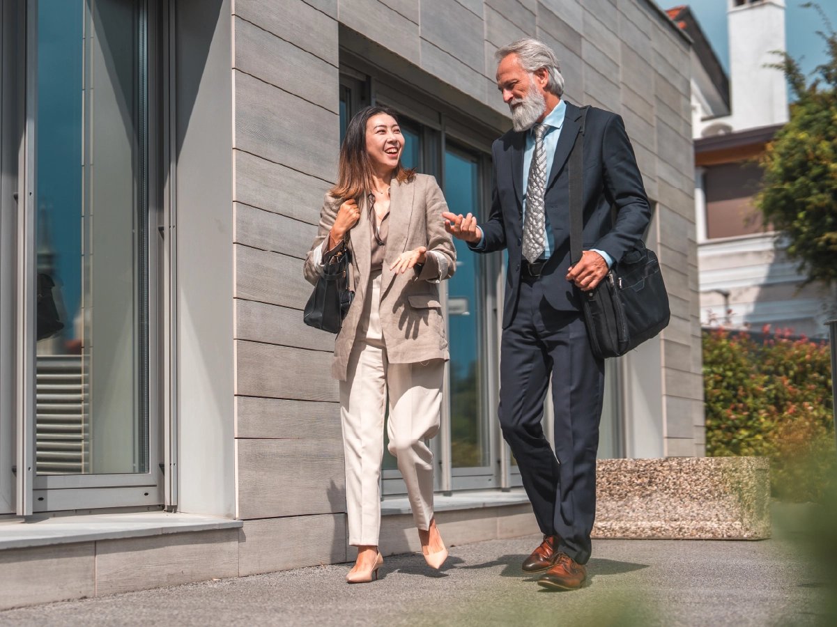 Two professional chatting while they walk