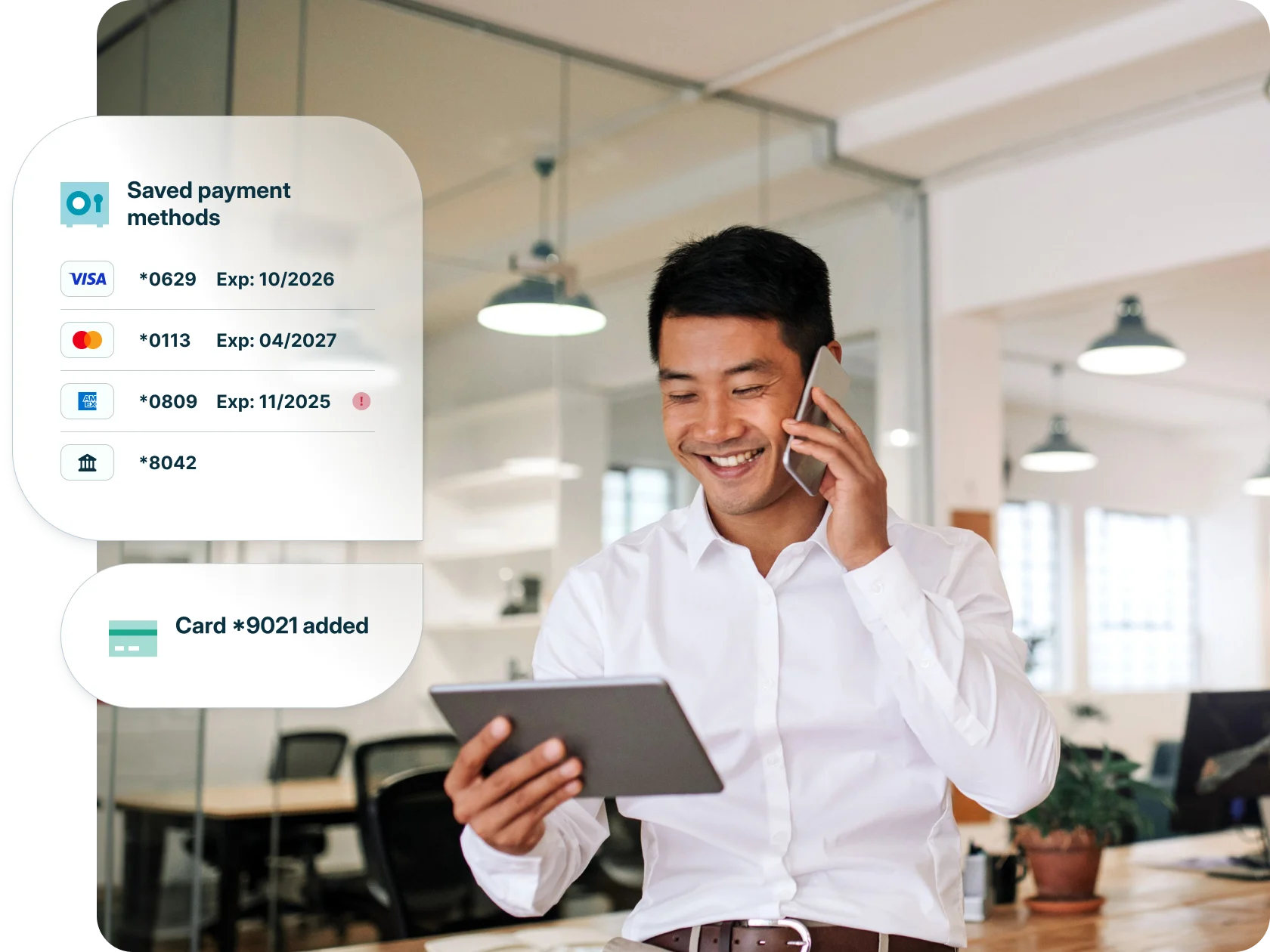 A man smiles while using his tablet to add a new credit card to his account